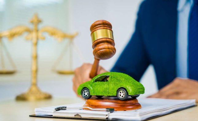 Sustainable Asian lawyer, 2050, in formal suit, tackles contracts with eco-focus.